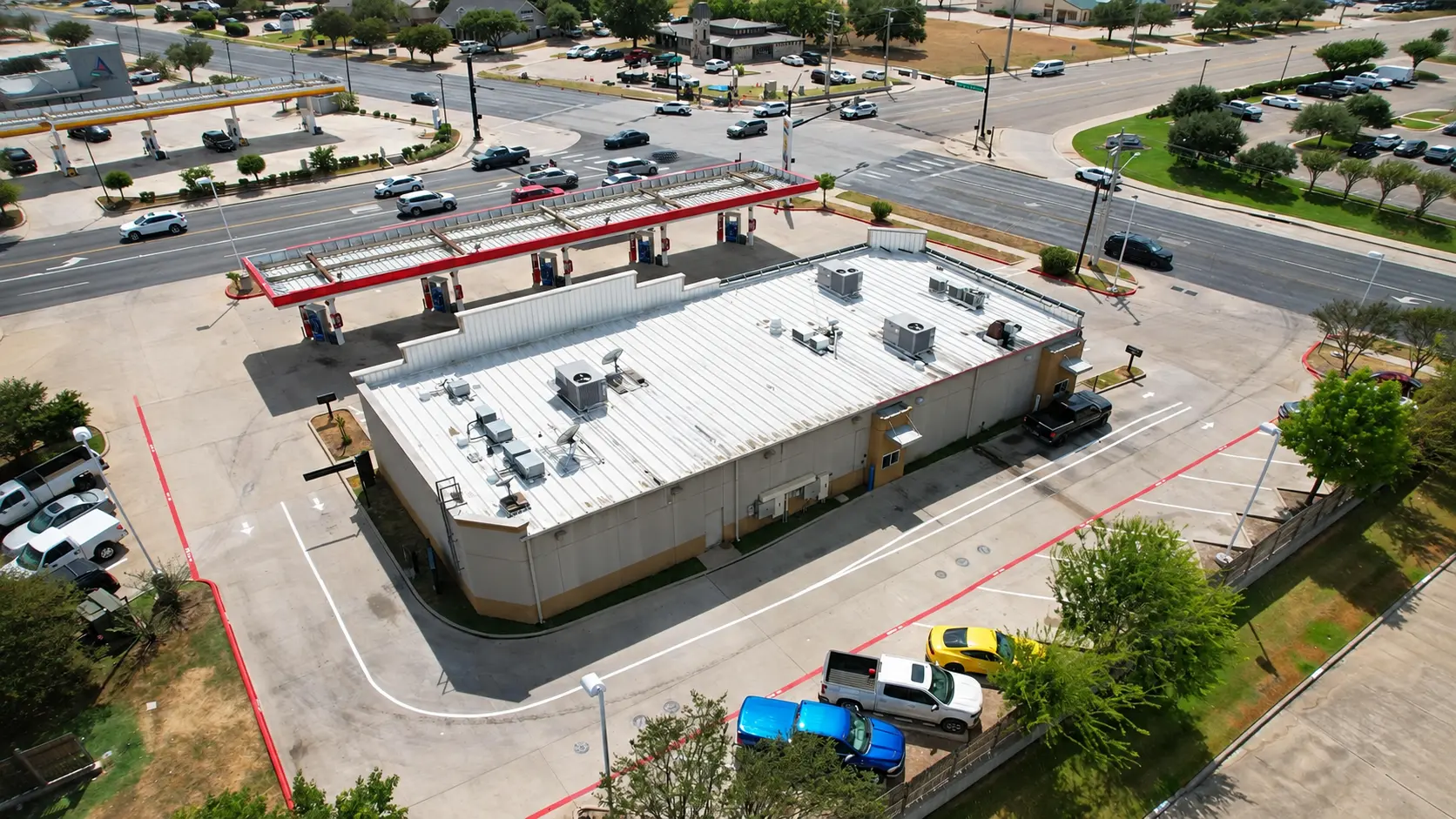 Aerial view of H-Town Line & Shine commercial parking lot markings and fire lane